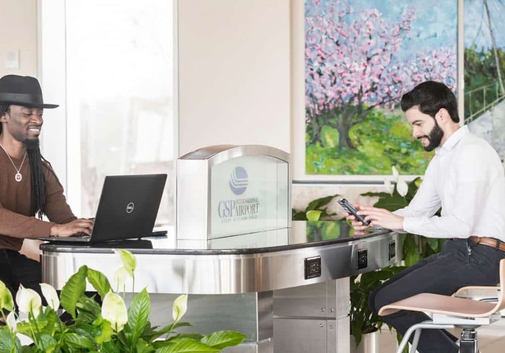 Two men working at GSP business workstation.