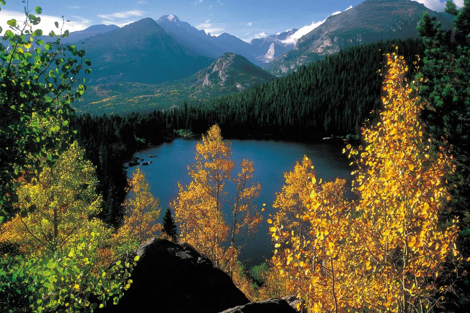 Mountains surrounding a pond in Denver, Colorado.