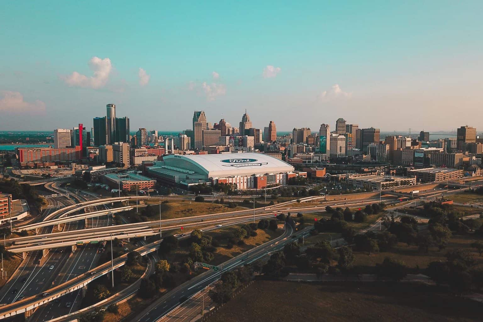 Aerial view of Detroit, Michigan, showing the interstate and a city skyline.