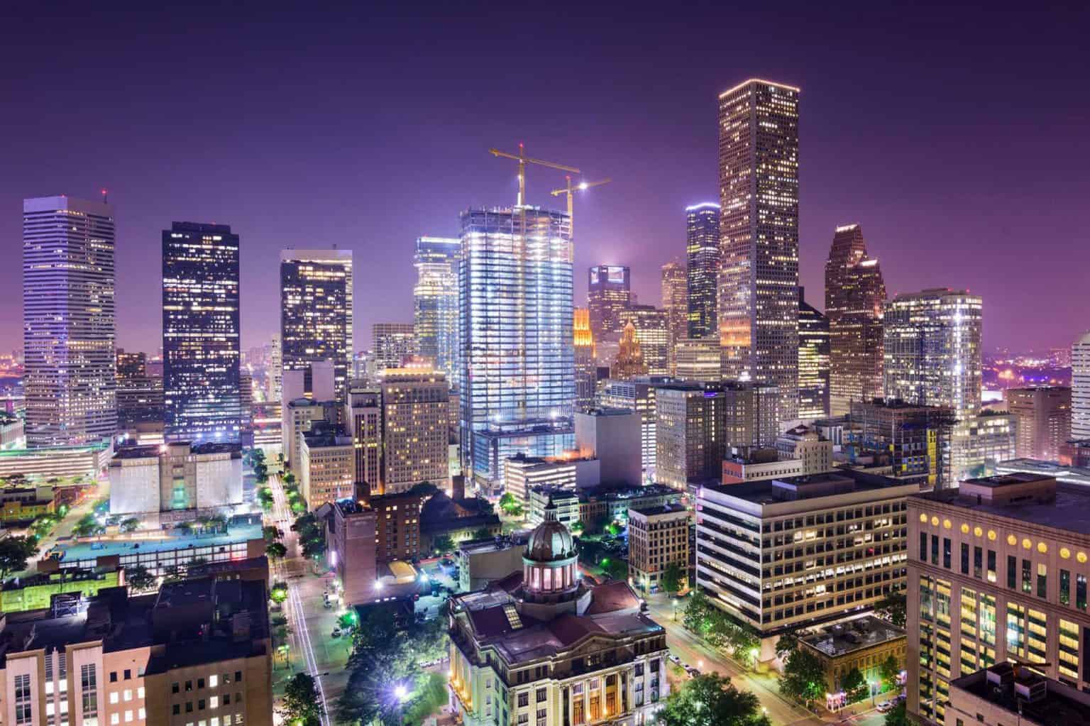 Aerial view of Houston, Texas, showing a nighttime city skyline.