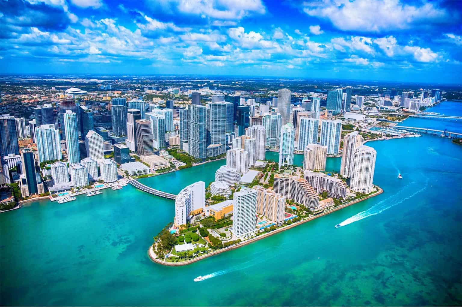 Aerial view of Miami, Florida, showing a blue coast and city skyline.