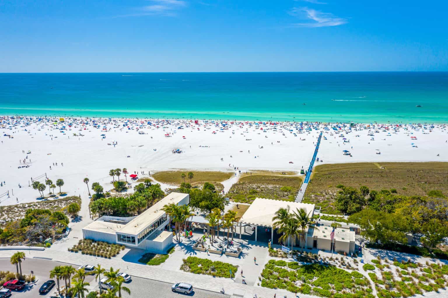 Ariel view of Sarasota beach with white sand and blue water.